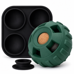Black silicone mold and green textured ball with cork center on a white background