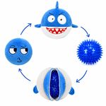 Blue shark-shaped toy with different textured parts on a white background